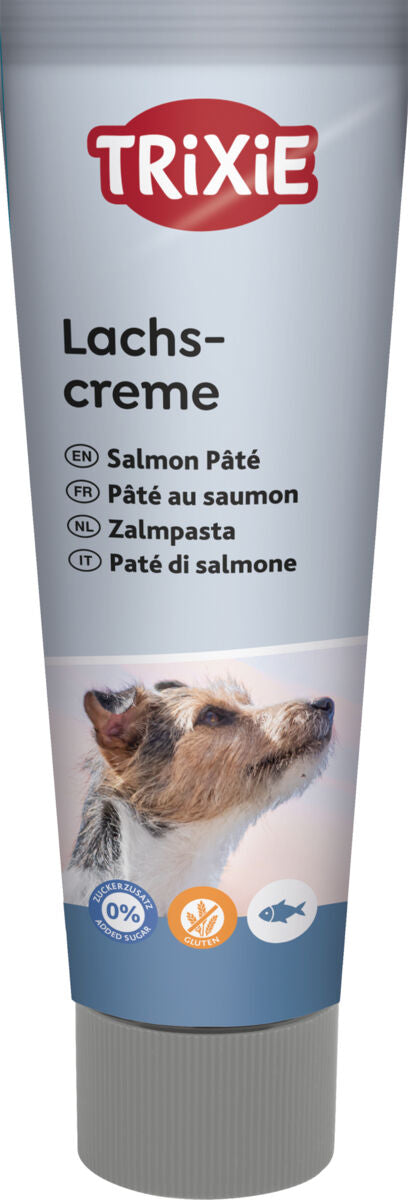 Eine silberne Tube mit der Aufschrift "Trixie Lachscreme" und einem Hundebild, darunter Symbole zu Zucker- und Glutenfreiheit.
