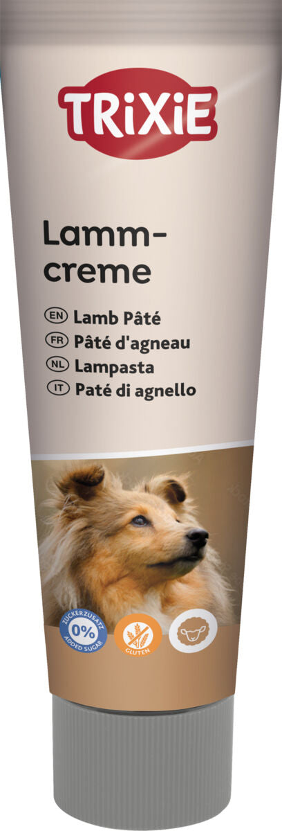 Eine Tube mit der Aufschrift „Lammcreme“ und einem Hundebild, darunter Hinweise auf keinen Zuckerzusatz und glutenfrei.