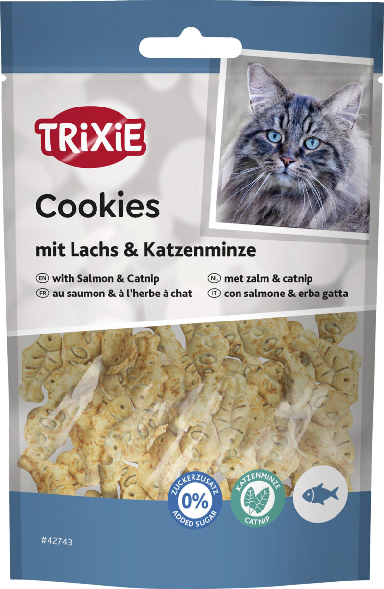 Verpackung mit Katzengesicht und Keksen in Fischform, beschriftet mit "TRIXIE Cookies mit Lachs & Katzenminze".
