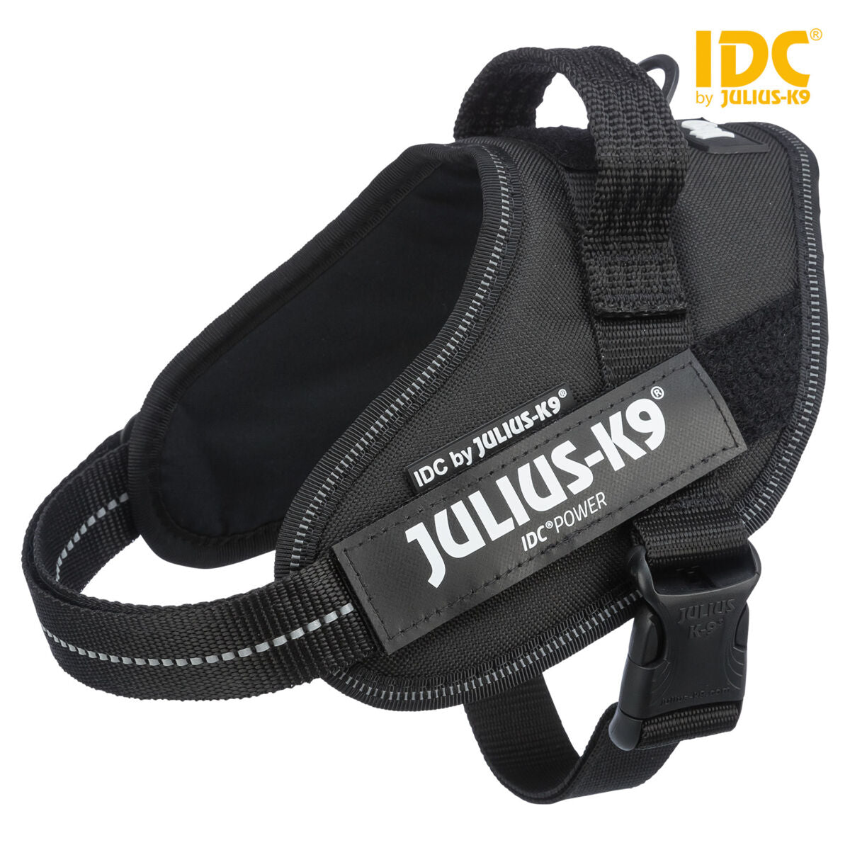 Schwarzes Hundegeschirr mit reflektierenden Streifen und sichtbarem Aufdruck "Julius-K9 IDC Power".