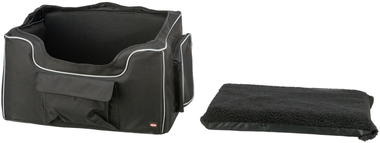 Schwarze Tragetasche mit weißen Rändern und seitlicher Tasche, daneben ein passendes schwarzes Polster.