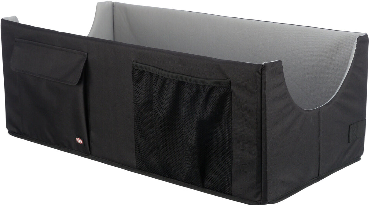 Schwarze, rechteckige Box mit grauem Innenraum, zwei Netz- und einer Klapptasche an der Seite.