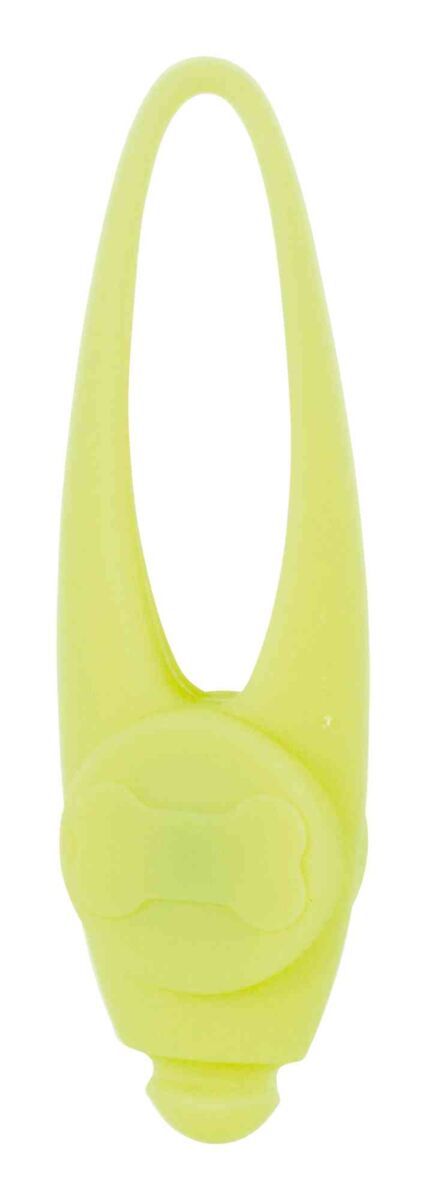 Gelbes lichtdurchlässiges Objekt mit ovalem Griff und rundem Element mit Knochenmotiv an der Basis.