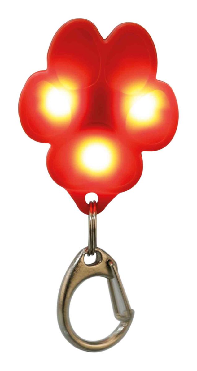 Rotes, leuchtendes Pfotenförmiges Accessoire mit drei gelben Lichtern und einem silbernen Karabinerhaken.