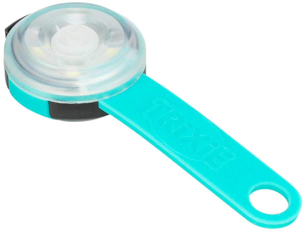 Rundes Leuchtsignal mit transparentem Gehäuse und türkisfarbenem Griff, auf dem "Trixie" steht.