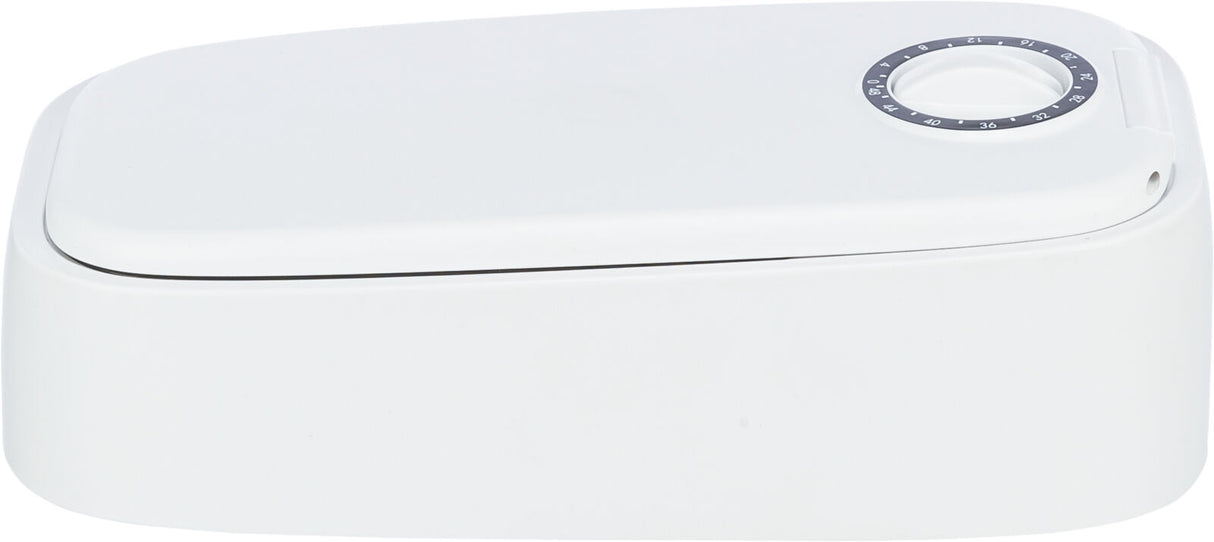 Weißes rechteckiges Gerät mit rundem Ziffernblatt auf der Oberseite.