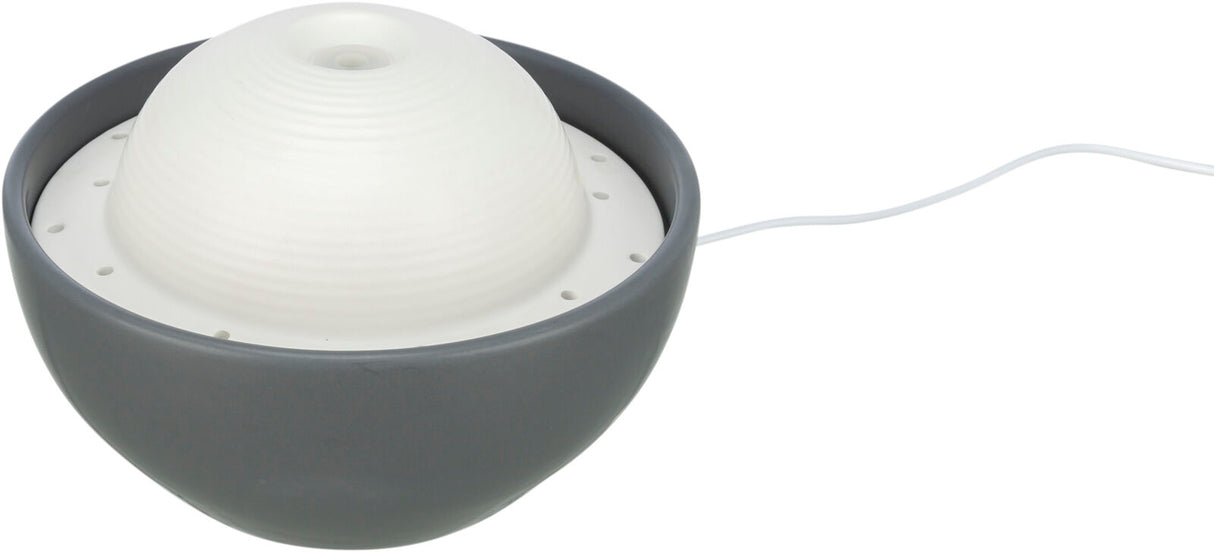 Runde, graue Kunststoffschale mit weißem, geripptem Deckel und einem Kabel an der Seite.