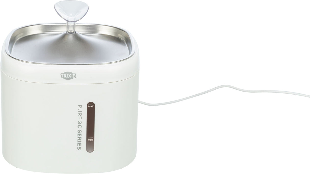 Weiße Wasserschale mit Edelstahloberfläche, dreieckigem Spender und seitlicher Wasserstandsanzeige, Kabel angeschlossen.