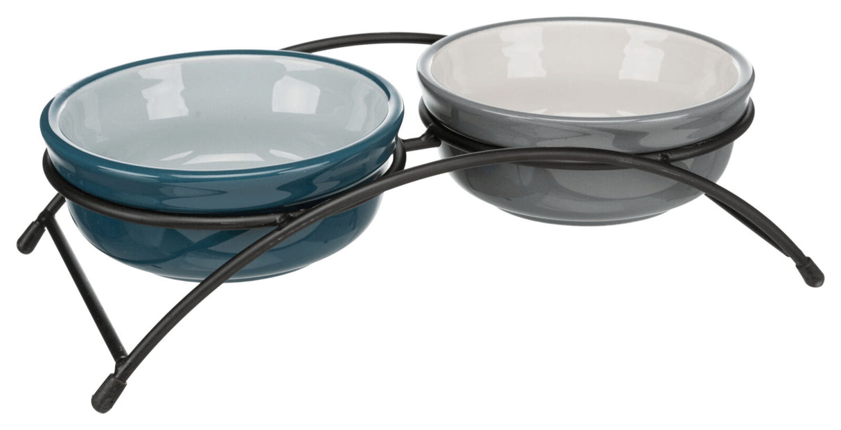 Zwei runde, unterschiedlich gefärbte Schalen aus Keramik in einem schwarzen Metallgestell.