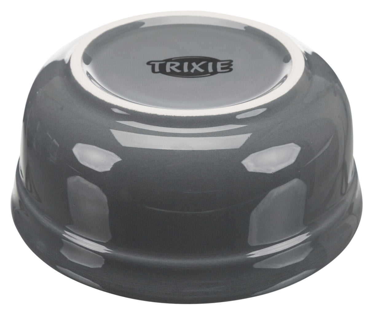 Graue Schüssel mit spiegelnder Oberfläche und dem Text "TRIXIE" auf der Unterseite, umgedreht aufgestellte.