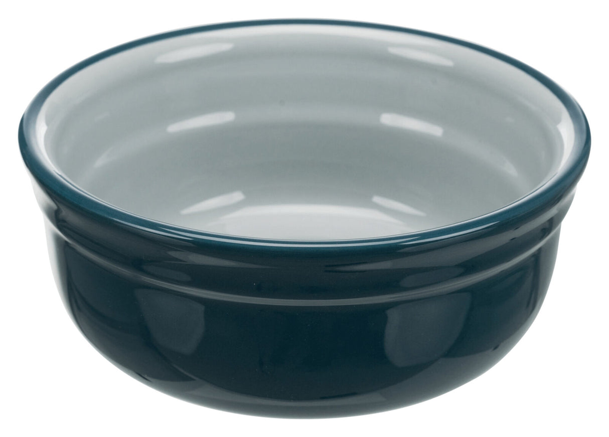 Runde Schüssel aus glänzendem, dunkelblauem Material mit hellem Inneren.
