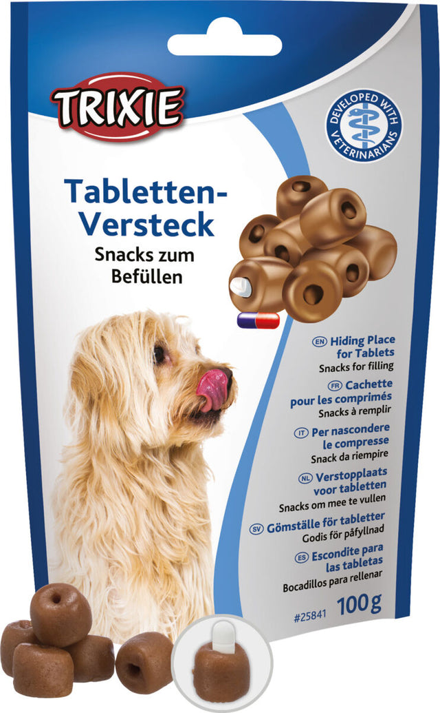 Tierfutterverpackung zeigt einen beige-braunen Hund mit geöffnetem Mund, daneben braune Snacks mit Loch, Markenname "Trixie".