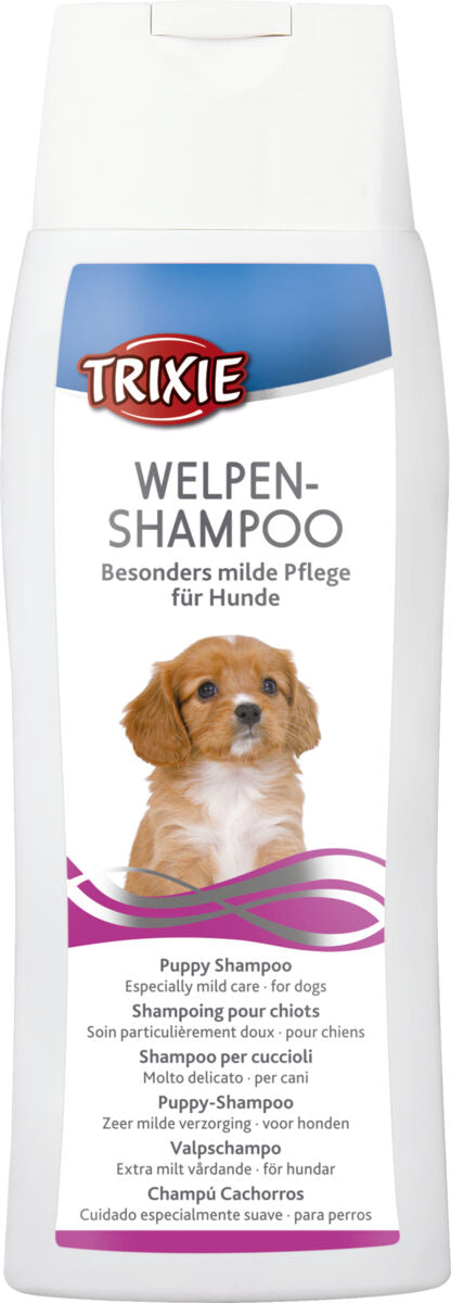 Eine weiße Flasche mit der Aufschrift "Welpen-Shampoo" und einem Bild eines Welpen, Marke "Trixie", besonders milde Pflege für Hunde.