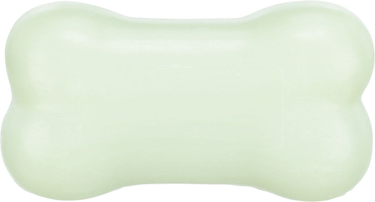 Hellgrünes seifenförmiges Objekt in Knochenform vor weißem Hintergrund.