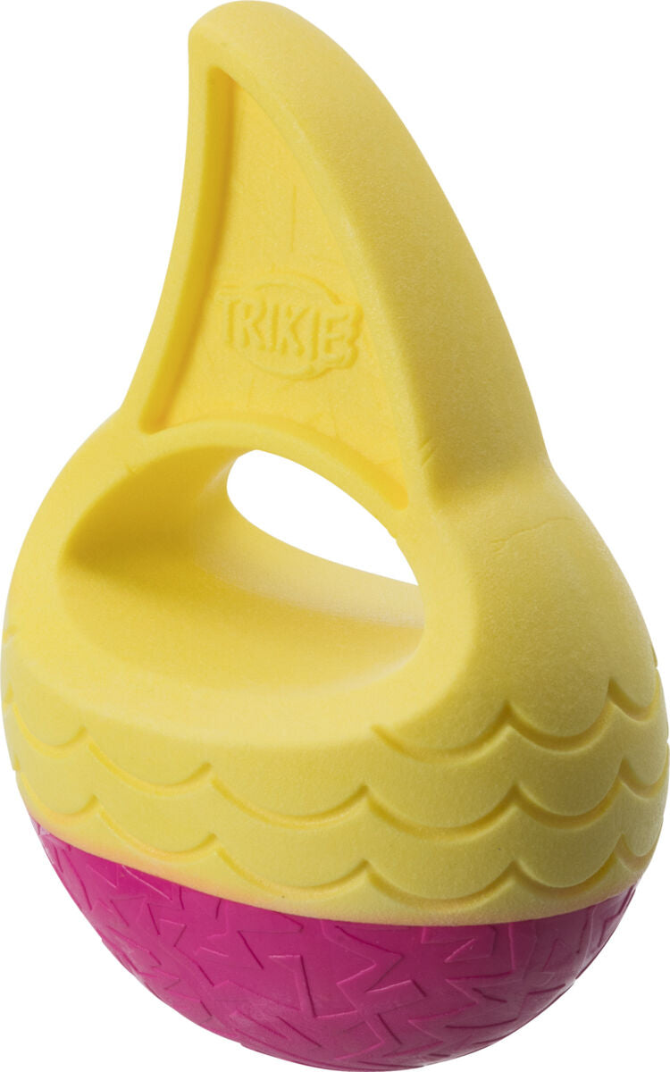 Gelbes und pinkes Kunststoffspielzeug in Form eines halben Balls mit Griff, Oberfläche teils strukturiert.