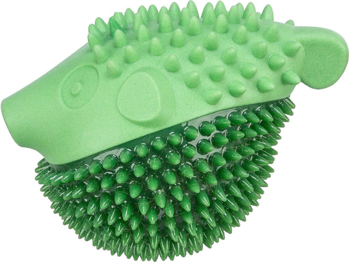 Grünes Spielzeug in Form eines Igels mit stacheliger Oberfläche und Kopfdetails.