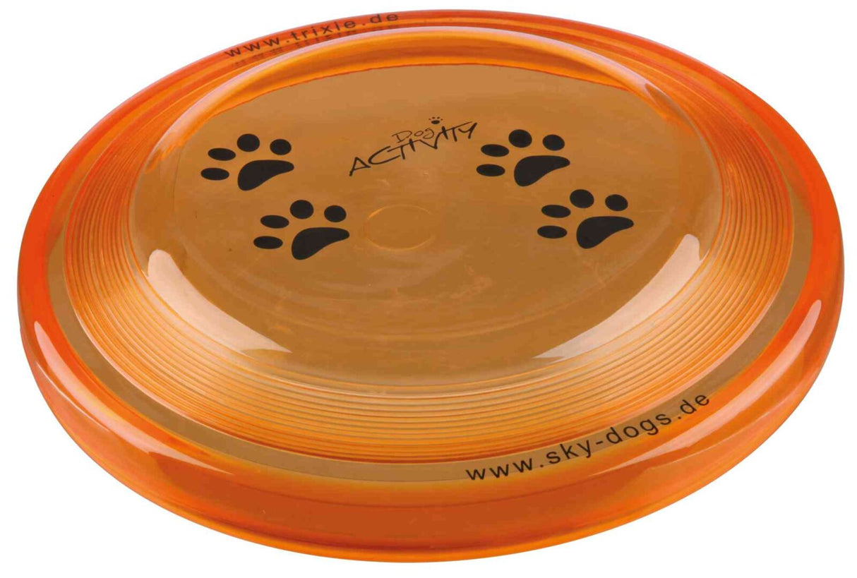 Orangefarbener Frisbee mit schwarzen Pfotenabdrücken und den Aufschriften "www.trixie.de" und "www.sky-dogs.de".