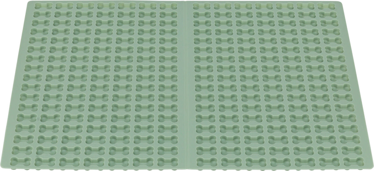 Grüne Silikonform mit regelmäßigen Knochenformenreihen über die gesamte Fläche verteilt.