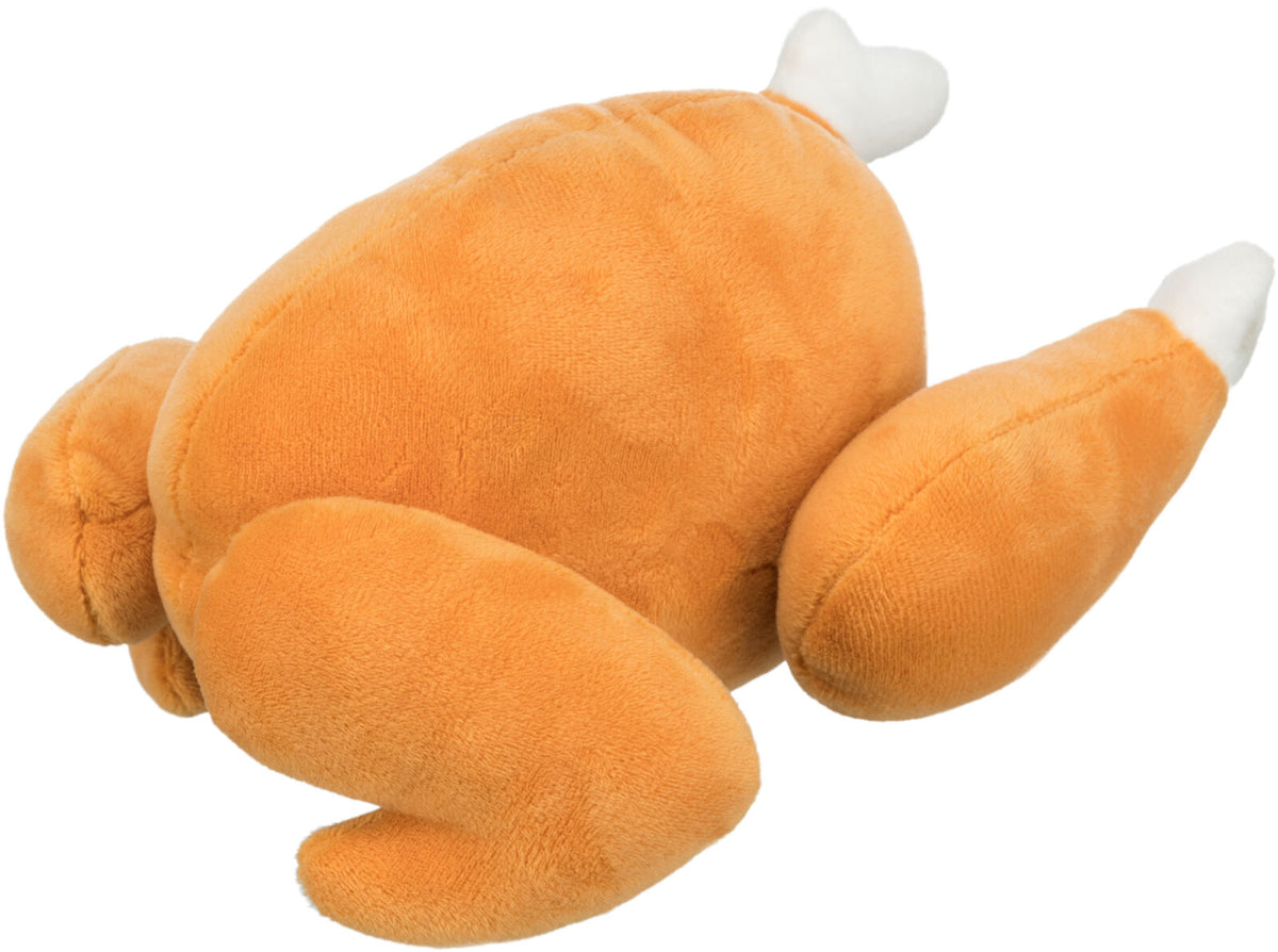 Plüschspielzeug in der Form eines gebratenen Hähnchens mit orange-brauner Farbe und weißen Enden.