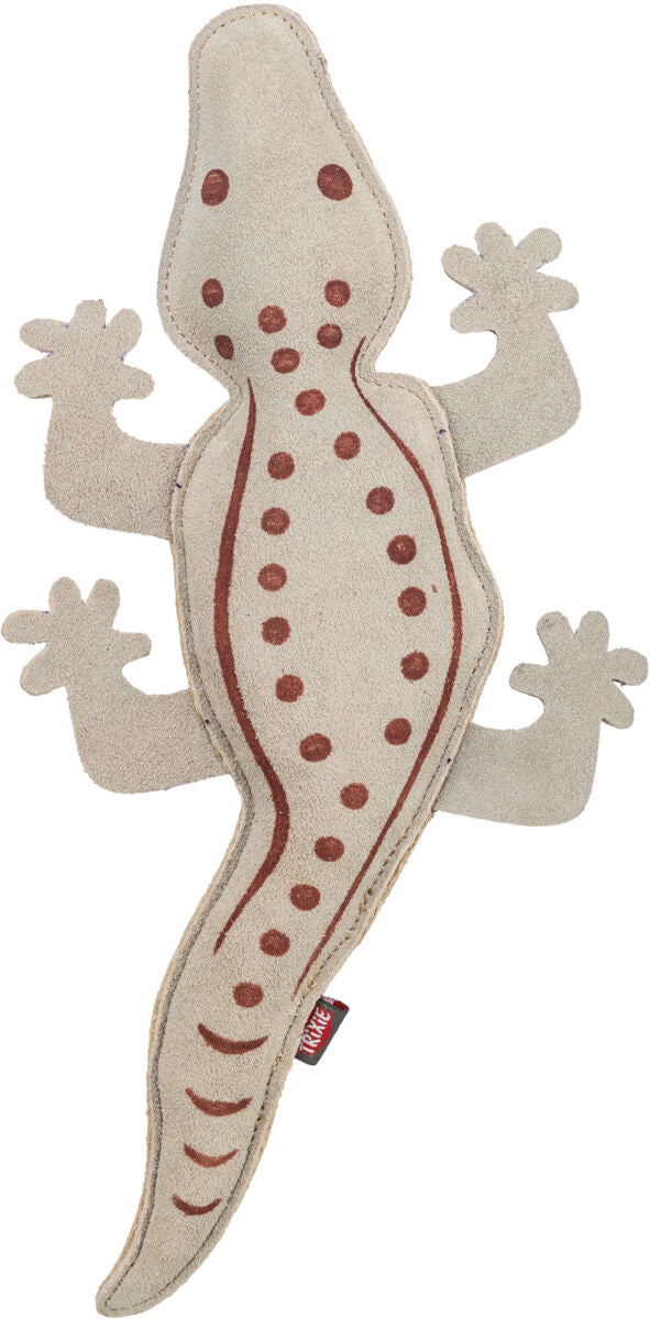 Spielzeug in Form eines beigefarbenen Krokodils mit braunen Punkten und Linien, aus einem stoffähnlichen Material.