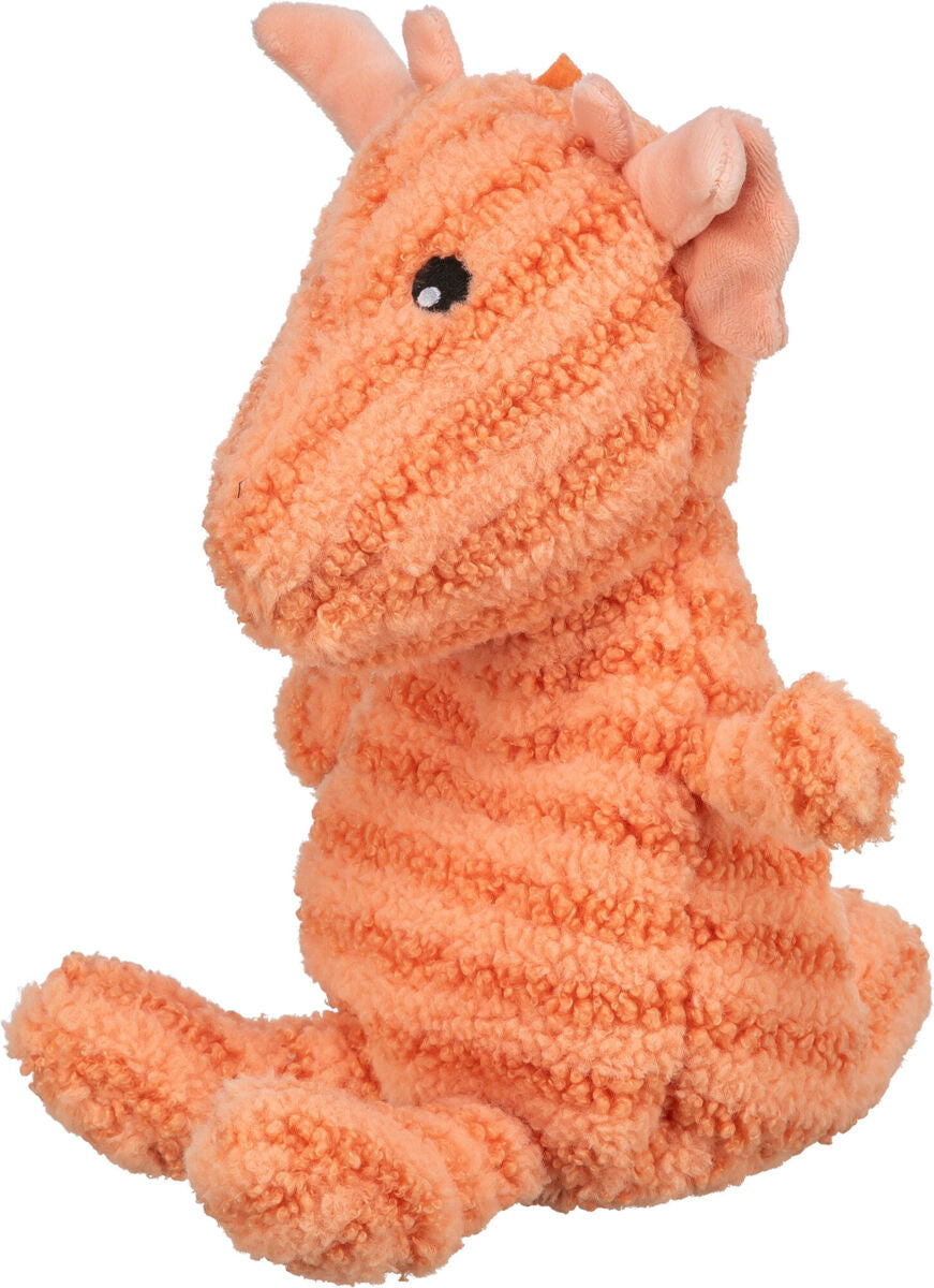 Ein orangefarbenes Stoffspielzeug in Form eines Drachens mit flauschiger Struktur und aufgenähten schwarzen Augen.