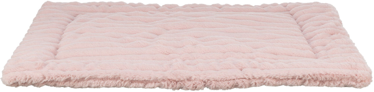 Rosa Decke mit flauschiger, geriffelter Oberfläche, rechteckig und weich, liegt flach auf dem Boden.