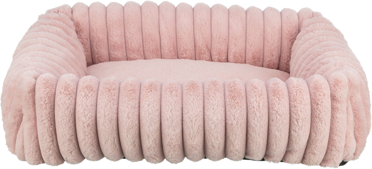 Ein hellrosa, flauschiges, rechteckiges Kissen mit geriffeltem Rand, geeignet als Sitz- oder Liegefläche.