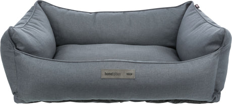Graues Hundebett mit hohem Rand aus Stoff, rechteckige Form, Label "homeEdition TRIXIE" sichtbar.