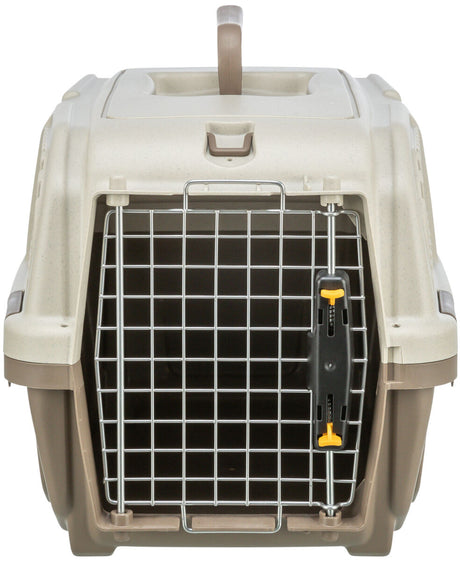 Beigefarbene Transportbox mit Metallgittertür und gelbem Verschluss, oberer Tragegriff sichtbar.