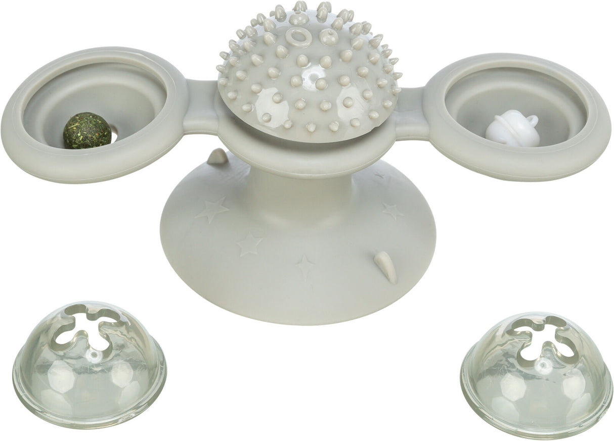 Grau-weißes Spielzeug mit strukturiertem Drehkopf, zwei kugelförmigen Elementen und abnehmbaren Abdeckungen.