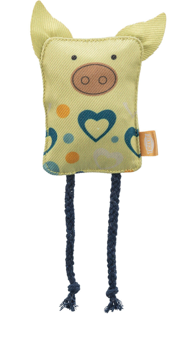 Gelbes Stoffspielzeug in Form eines stilisierten Schweins mit blauen Flecken, Herzmustern und geflochtenen Seilen als Beine.