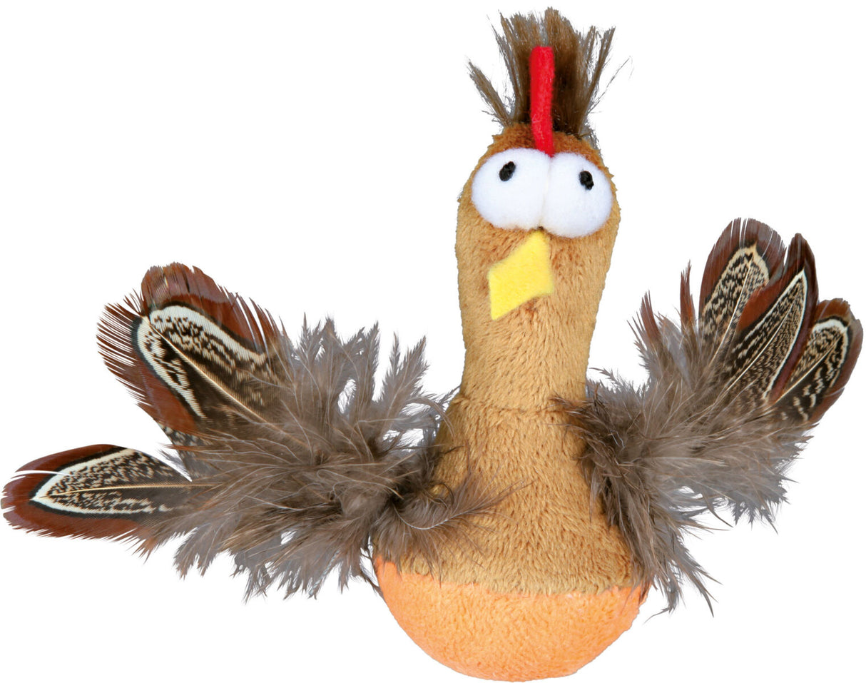 Plüschspielzeug in Form eines Vogels mit großen Augen und bunten Federn in Braun- und Beigetönen.