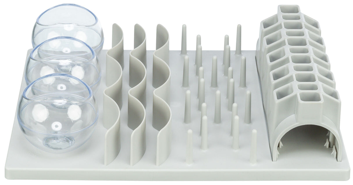 Kombination aus grauen Plastikstrukturen mit Kugeln, Wellen, Stäben und einer röhrenförmigen Öffnung.