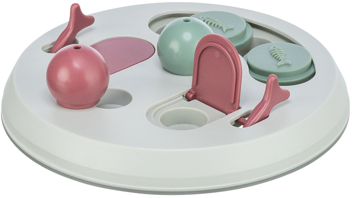 Rundes Spielzeug mit rosa und grünen Elementen auf weißem Hintergrund, enthält bewegliche Teile wie Klappen und Knöpfe.