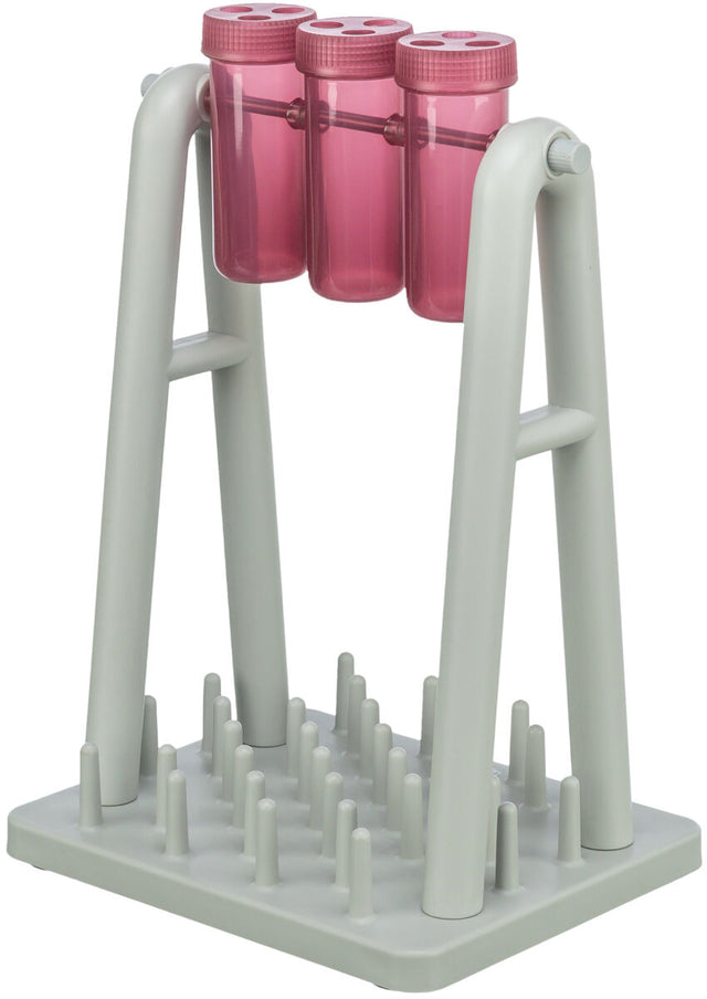 Graues Gestell mit drei rosa Zylindern oben und einer Basis mit Stiften darunter.