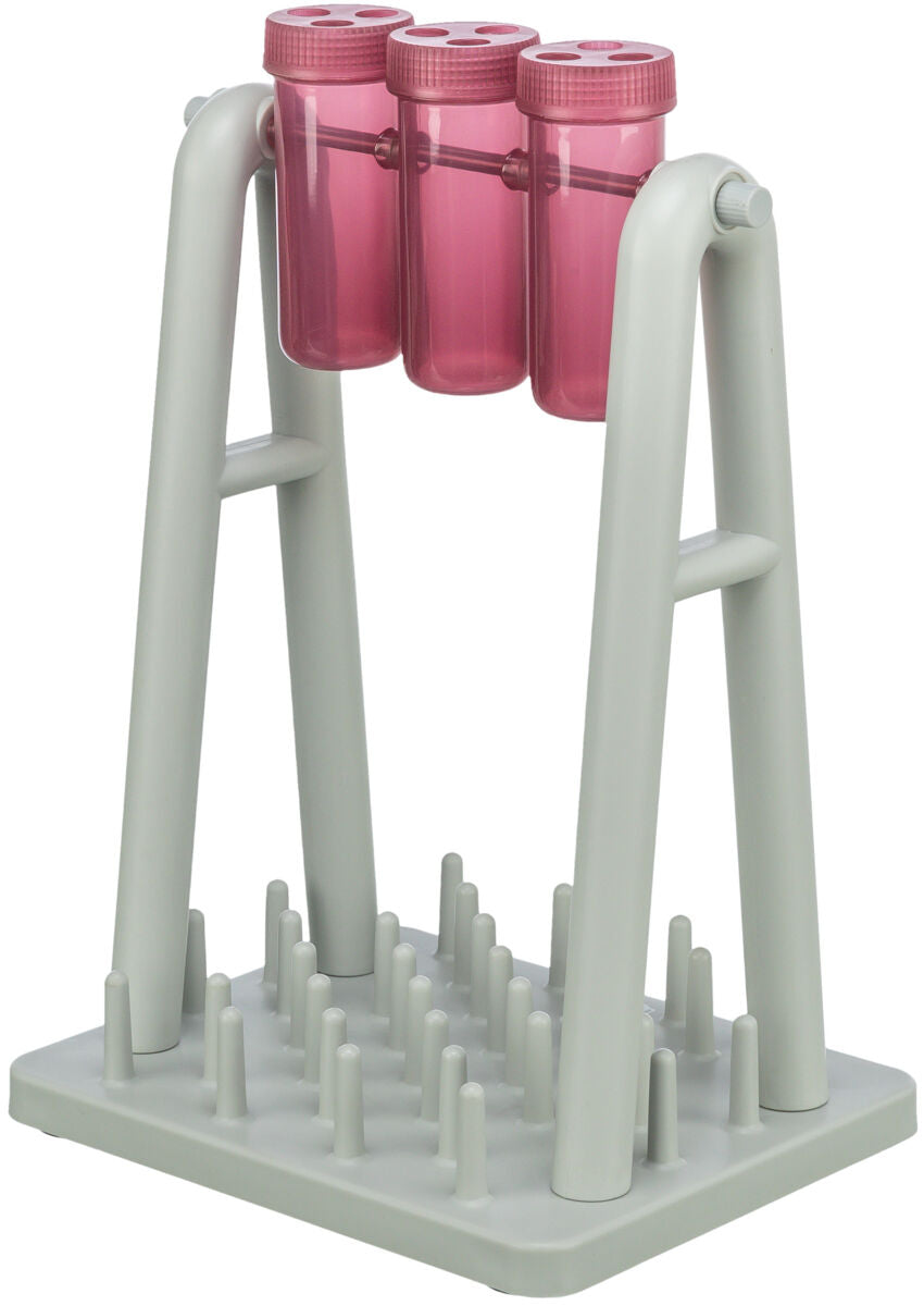 Graues Gestell mit drei rosa Zylindern oben und einer Basis mit Stiften darunter.