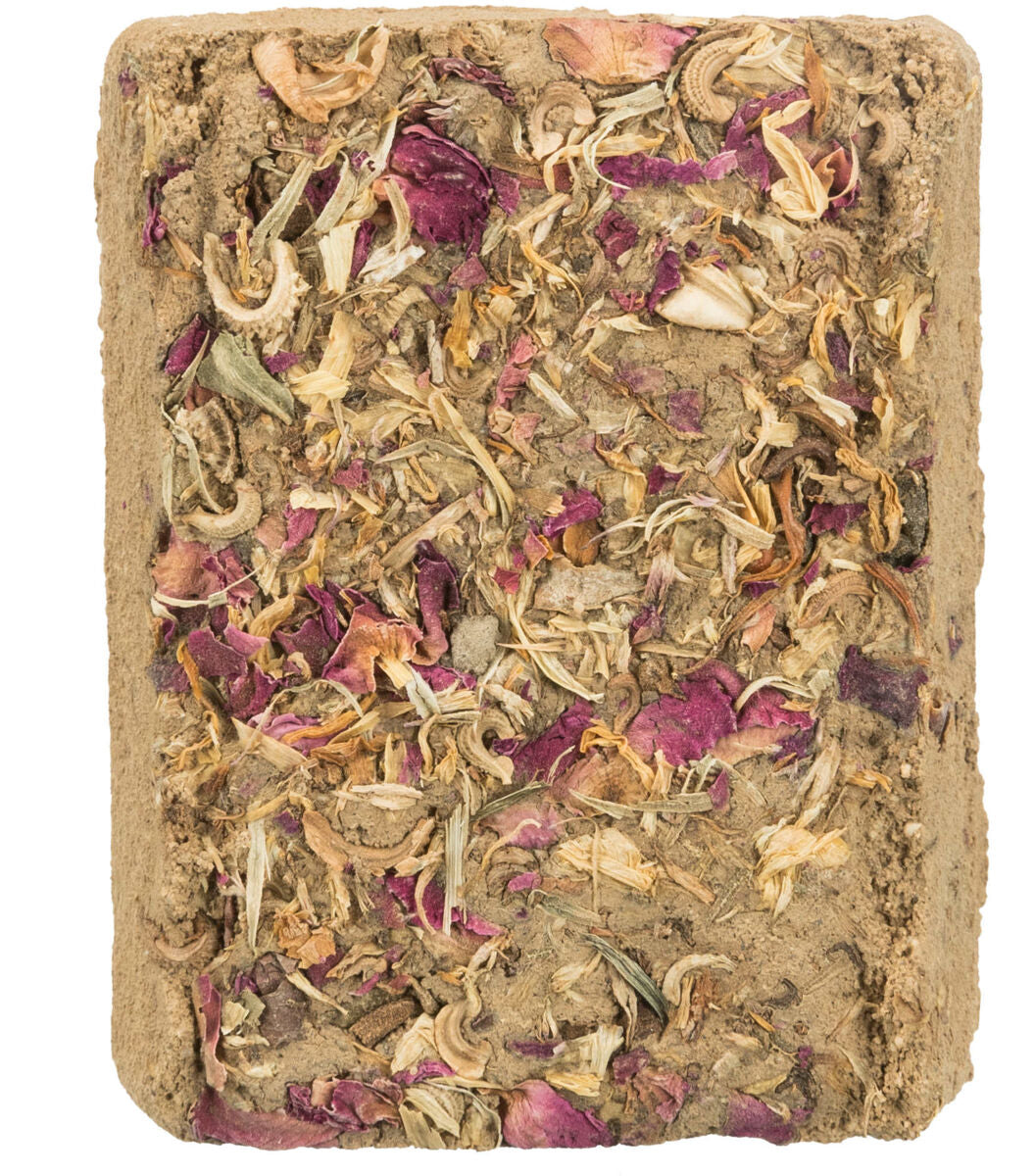 Rechteckiger Block aus verdichtetem Material mit eingearbeiteten getrockneten Blütenblättern in Rosa und Beige.