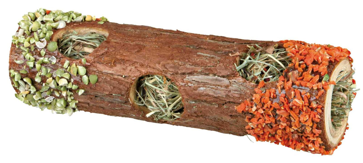 Brauner hohler Holzstamm mit grünen und orangenen Stücken garniert, gefüllt mit Heu und Trockengemüse.