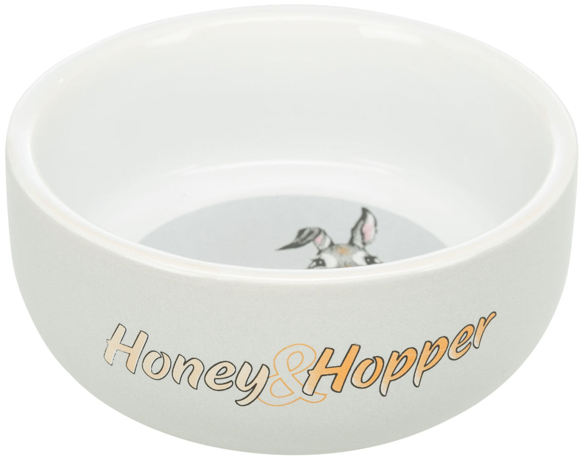 Weiße Schale mit der Aufschrift "Honey & Hopper" und einem Kaninchenmotiv innen.