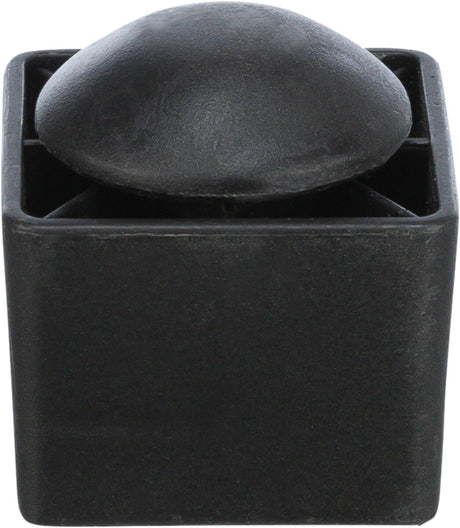 Ein schwarzes quadratisches Objekt mit einer gewölbten Oberseite und einer strukturierten Oberfläche.