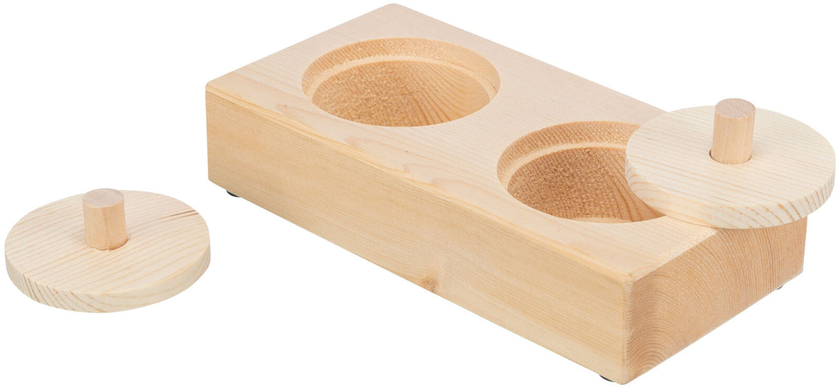 Holzblock mit zwei runden Vertiefungen und passenden, abnehmbaren Abdeckungen, naturbelassene Holzoptik.