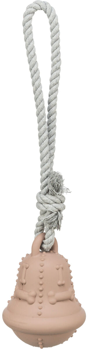 Spielzeug mit beigem Gummiball und grauem Seil, Ball mit Knochenmuster und Noppen verziert.