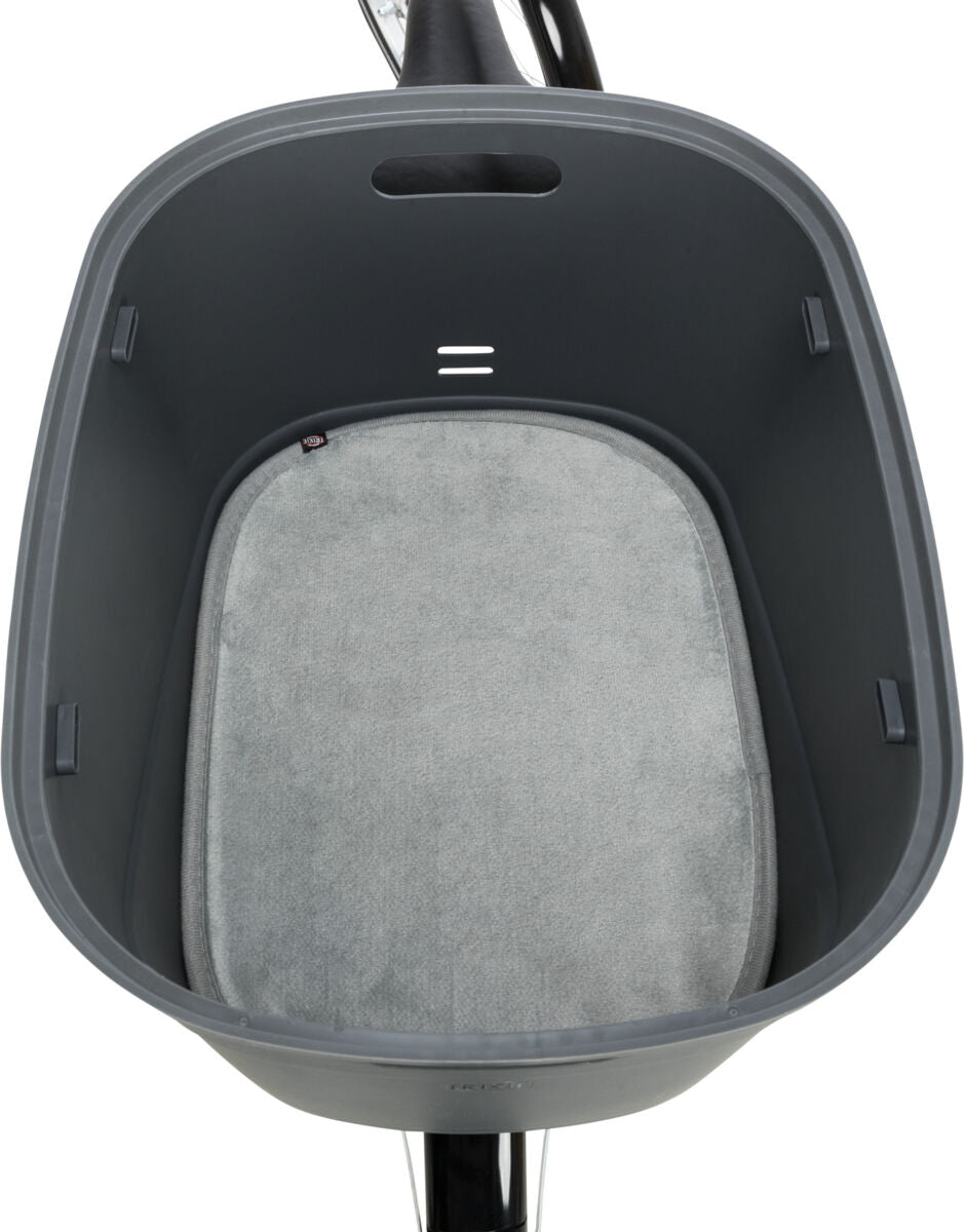 Grauer Fahrradanhänger mit weichem grauem Polster und Haltegriff, oben fotografiert.