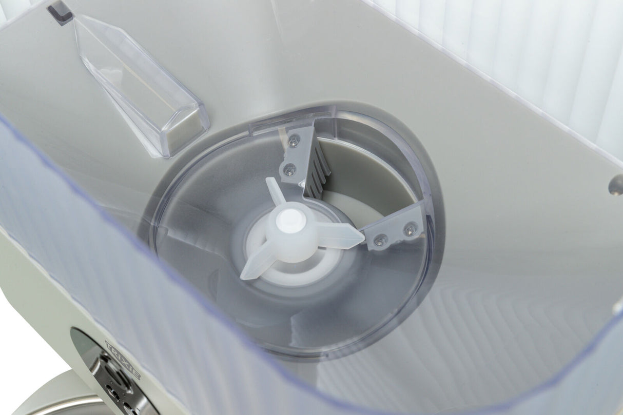 Ein hoher transparenter Behälter mit einem weißen Plastik-Gestell und einer zentralen Drehscheibe aus Kunststoff.