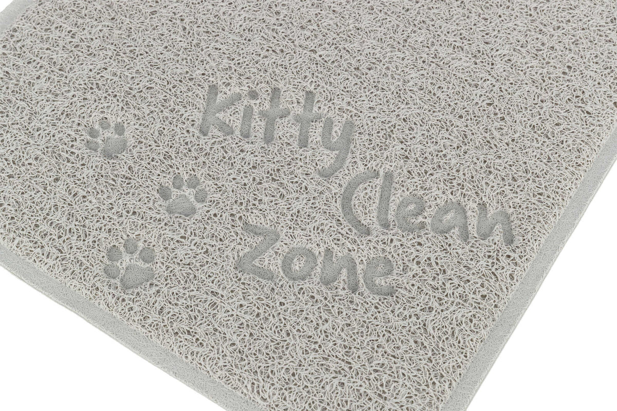 Graue Matte mit strukturiertem Muster und der Aufschrift "Kitty Clean Zone" sowie Pfotenabdrücken.