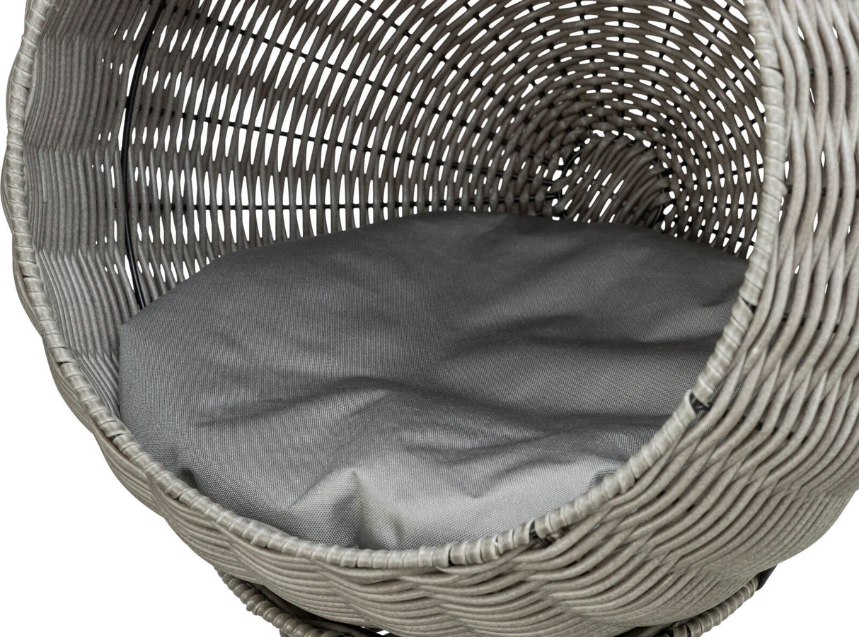 Geflochtener Korb in Grau mit runder Form, innen ein graues Polsterkissen, von oben sichtbar.