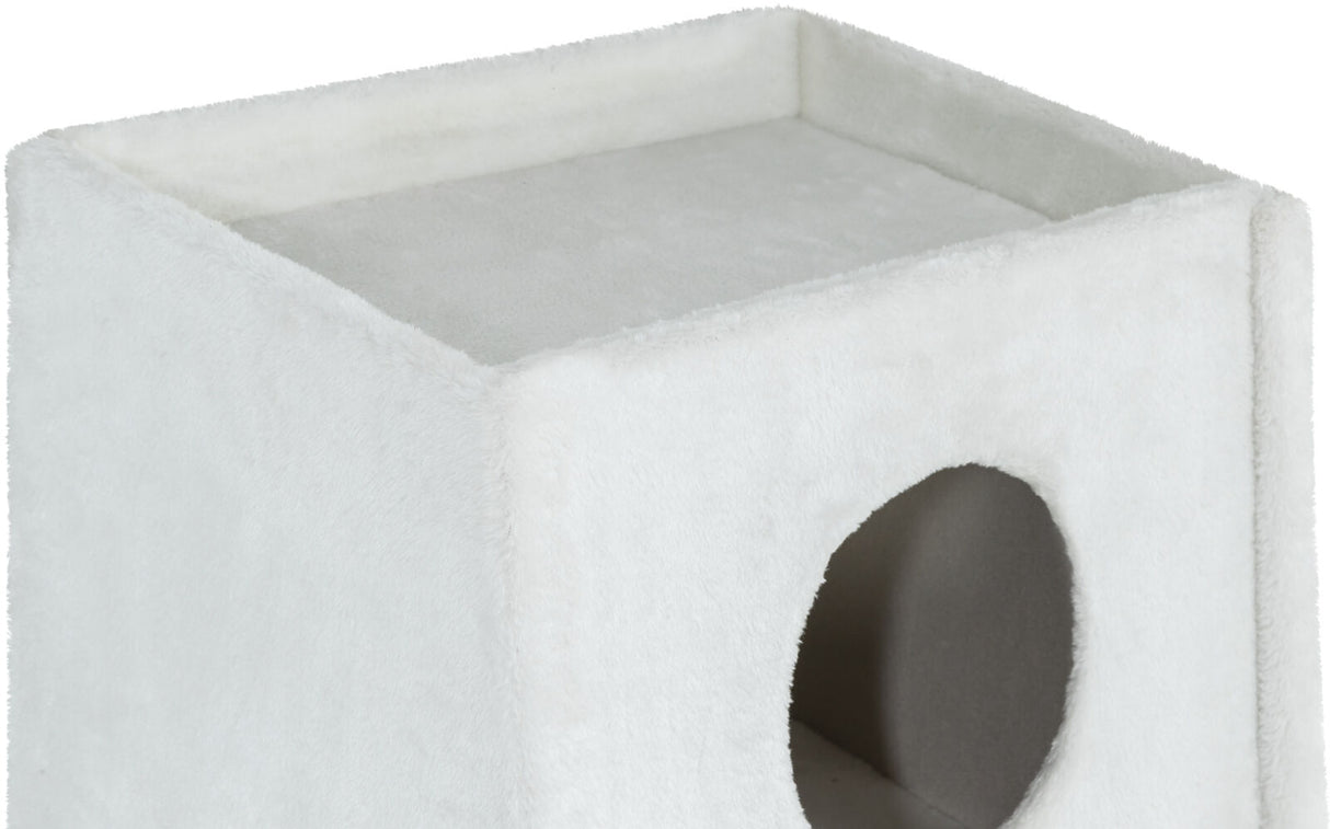 Weißer, würfelförmiger Gegenstand mit flauschiger Oberfläche und seitlich erkennbarer runder Öffnung.