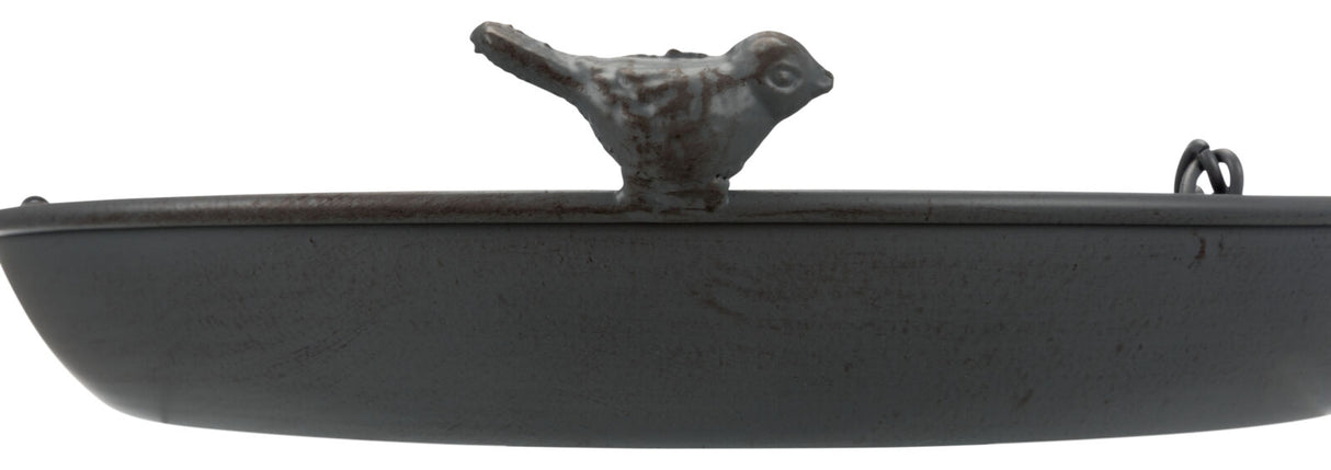 Schale aus grauem Metall mit kleinem Vogel auf Rand, unten zwei Metallringe.