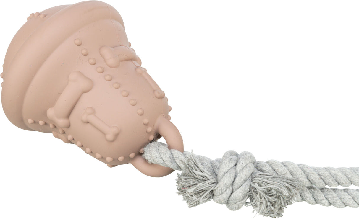 Rosa Hundespielzeug mit Knochenmuster und grauer Seilbefestigung, Knotendetails sichtbar.