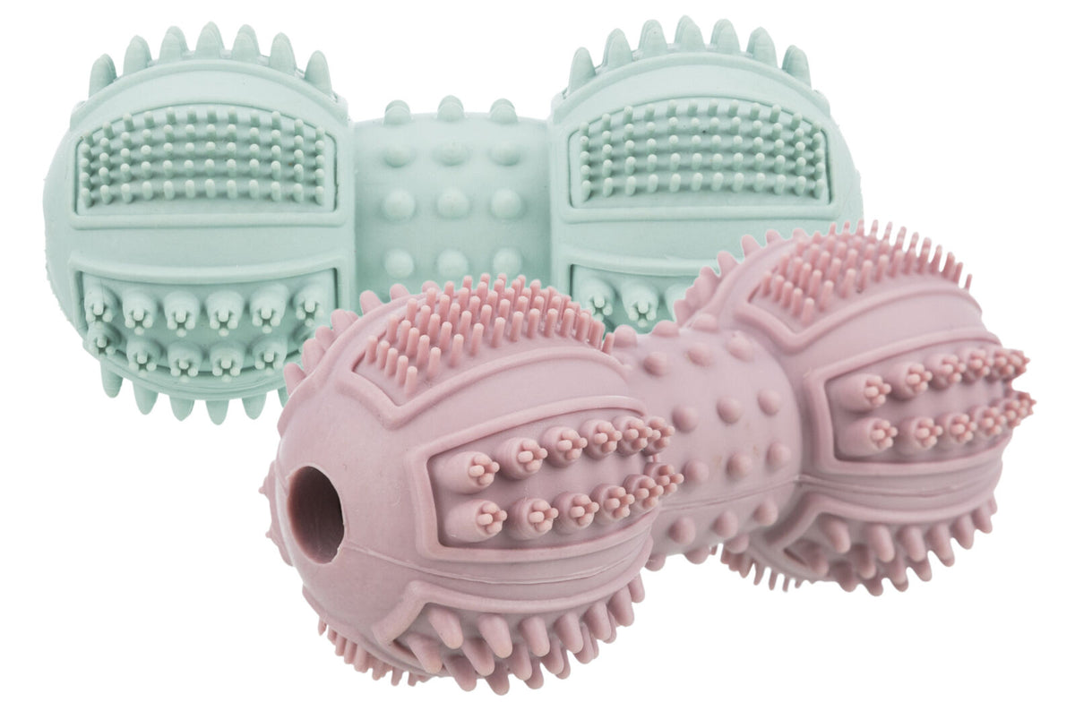 Zwei stachelige, zylinderförmige Gummispielzeuge in Rosa und Hellgrün mit Texturmustern.